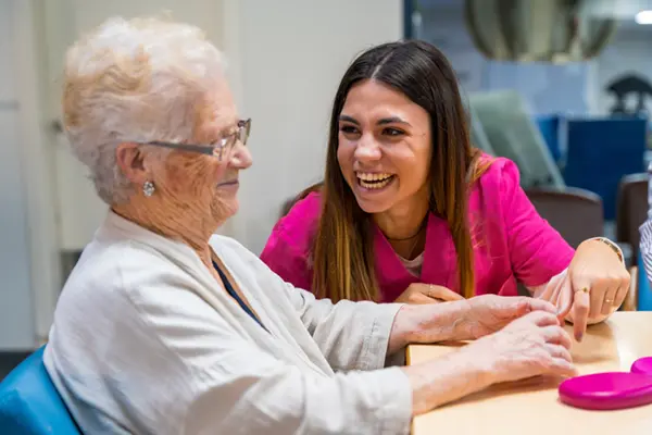 Picture of a woman helping an elderly lady with her shopping