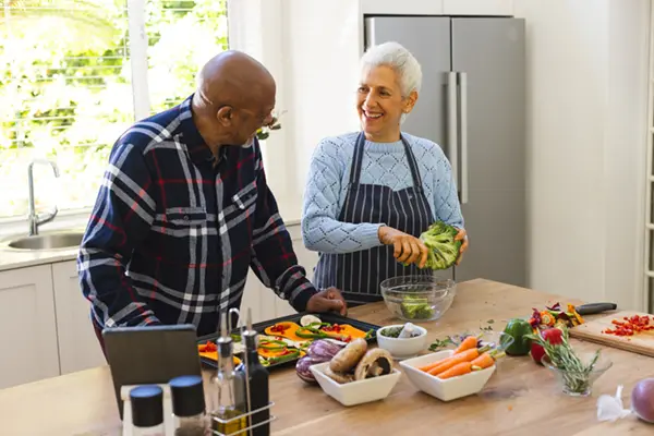 Picture of a woman helping an elderly lady with her shopping