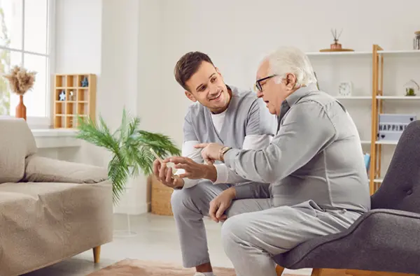Picture of a woman helping an elderly lady with her shopping
